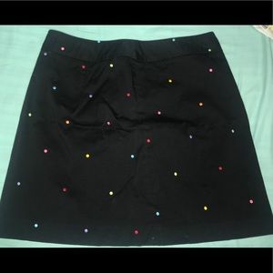 Black polka dot mini skirt